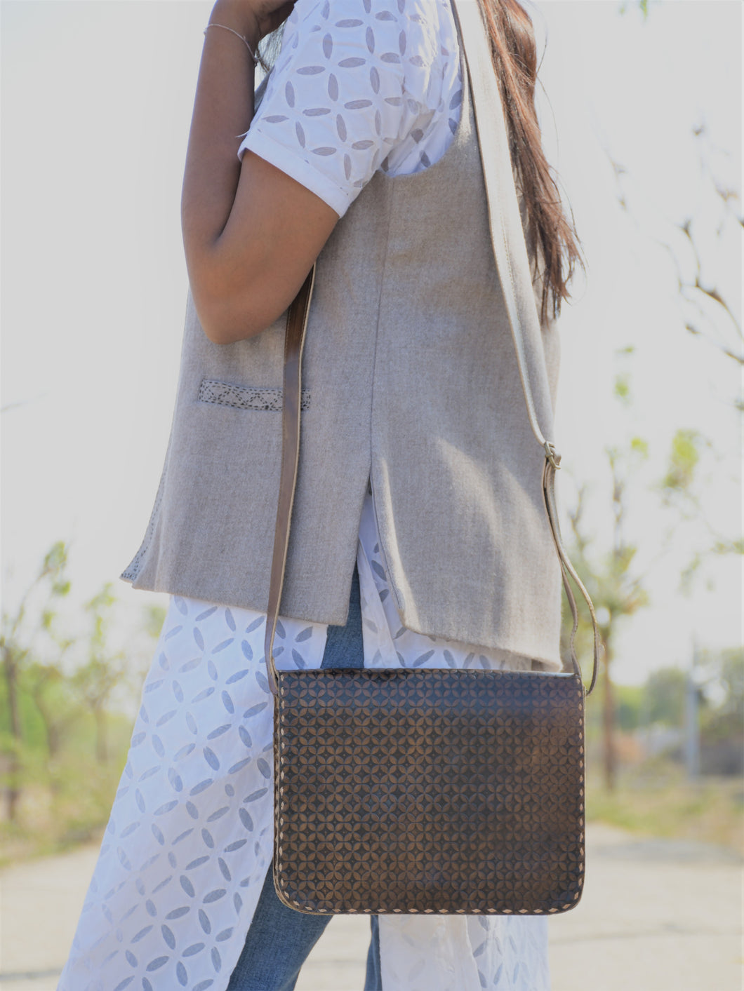 Brown Embossed leather sling bag